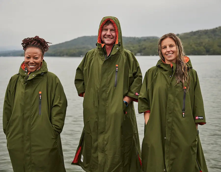 3 people wearing the pro change robes smiling into the camera