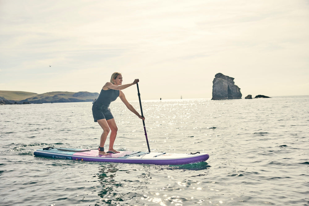 Woman paddleboarding at South Milton Sands