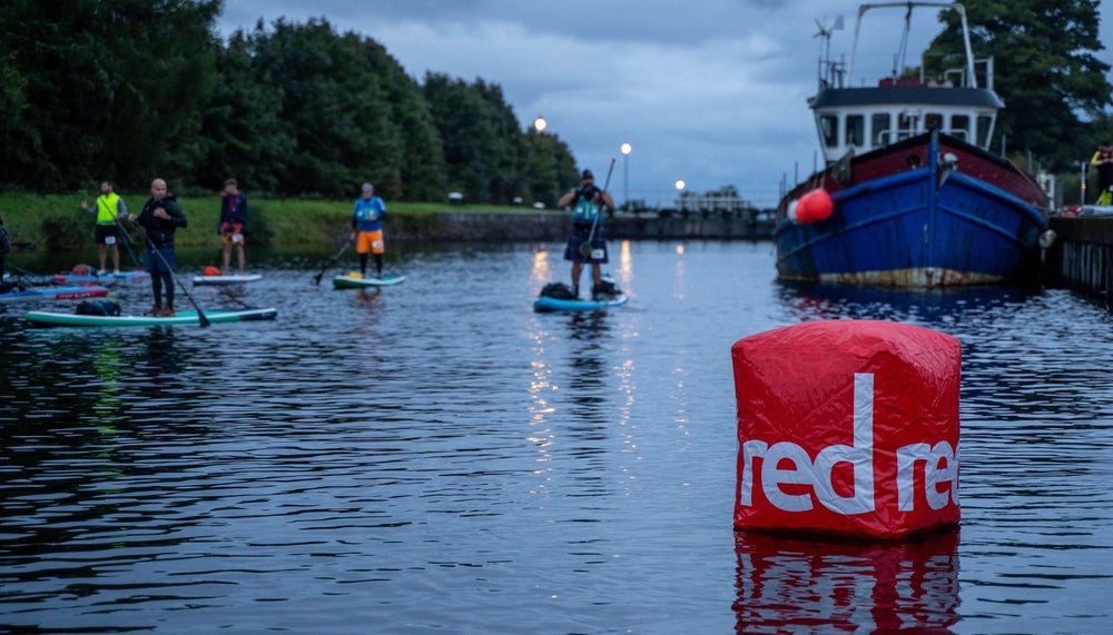 a low-light paddle board race