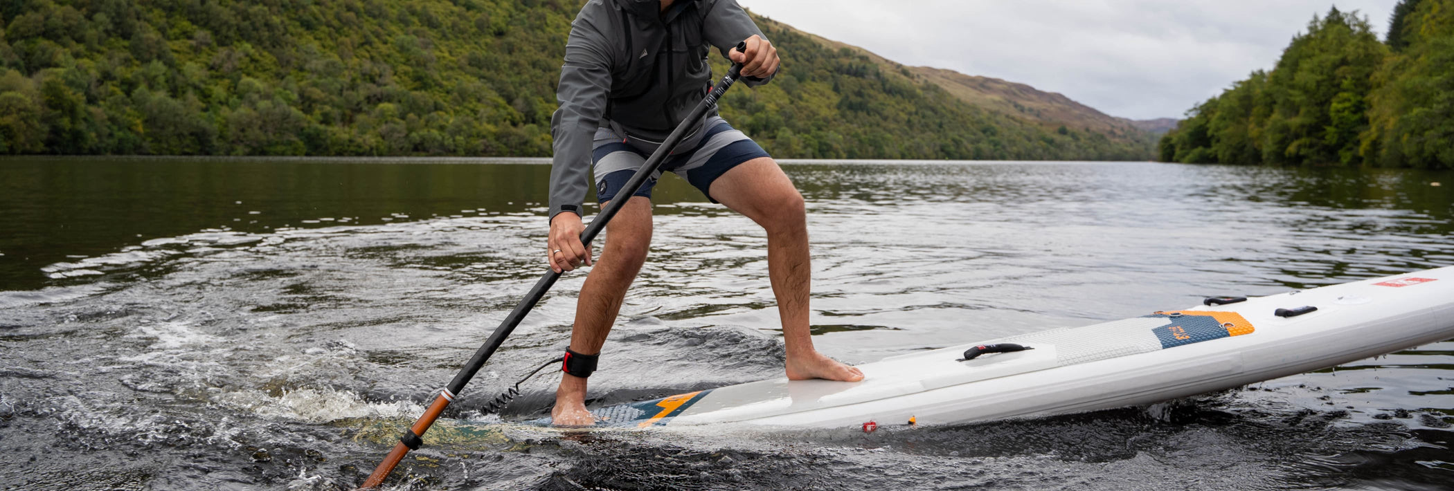 close up of man turning on paddleboard