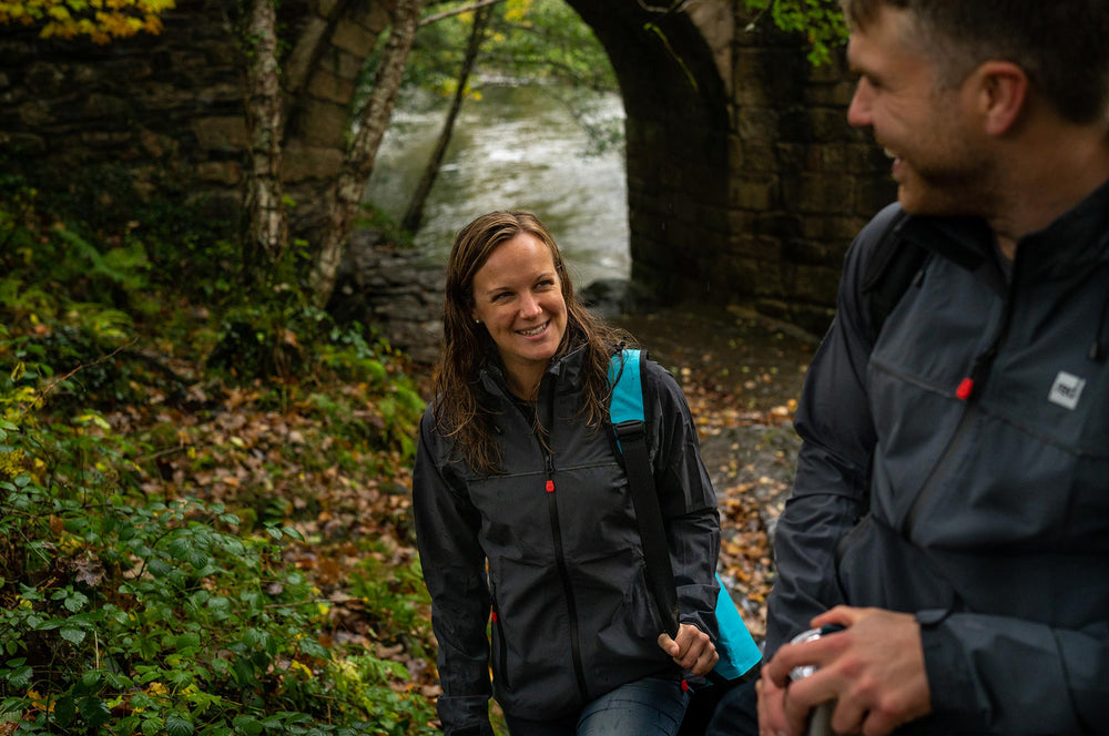 Woman looking longingly at man in a forest