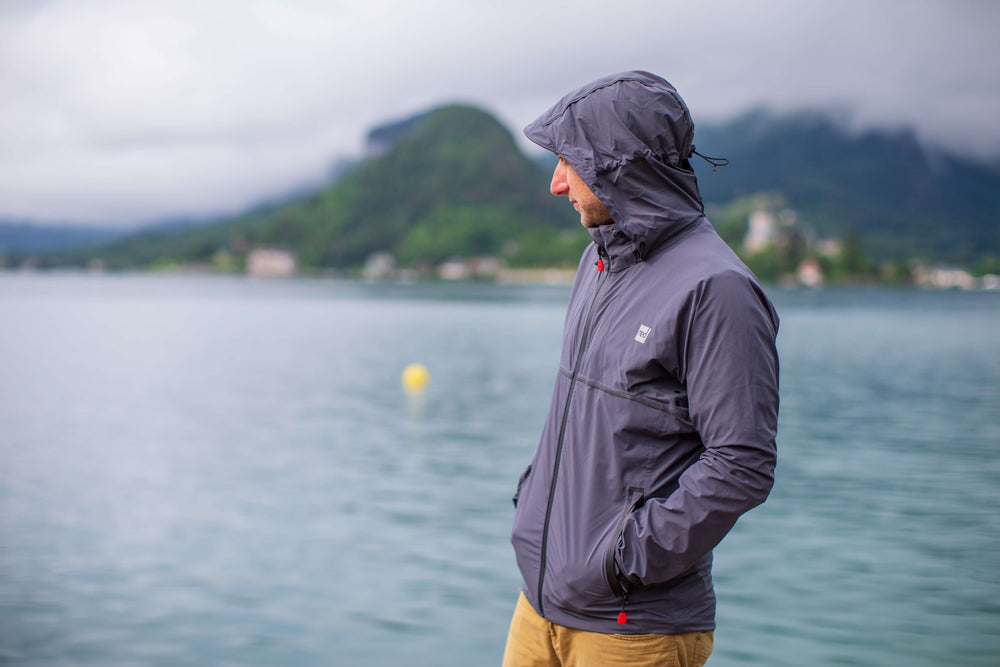 Man Wearing Waterproof Active Jacket While Looking Out On A Lake