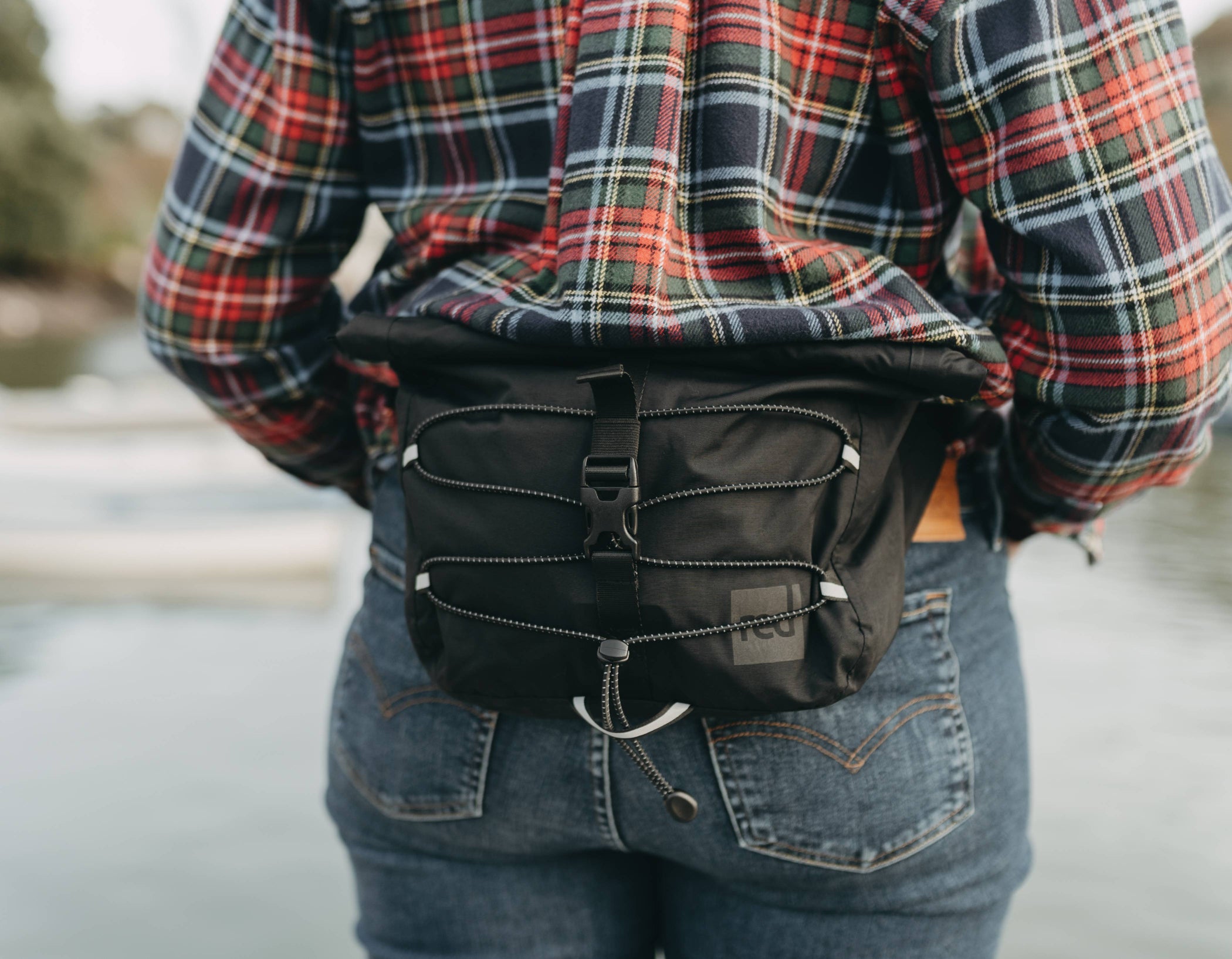 a close up of the waterproof crossbody bag being worn