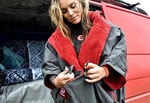 female outdoors next to camper van