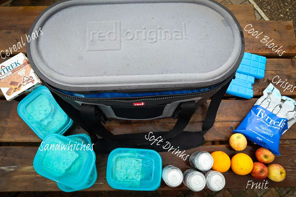 The Red Original Waterproof Cooler Bag Surrounded by food