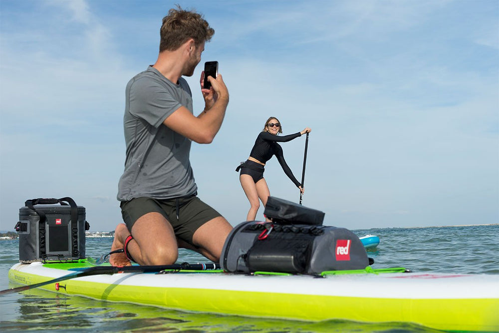 The Deck Bag and Dry Pouch with people on paddle boards