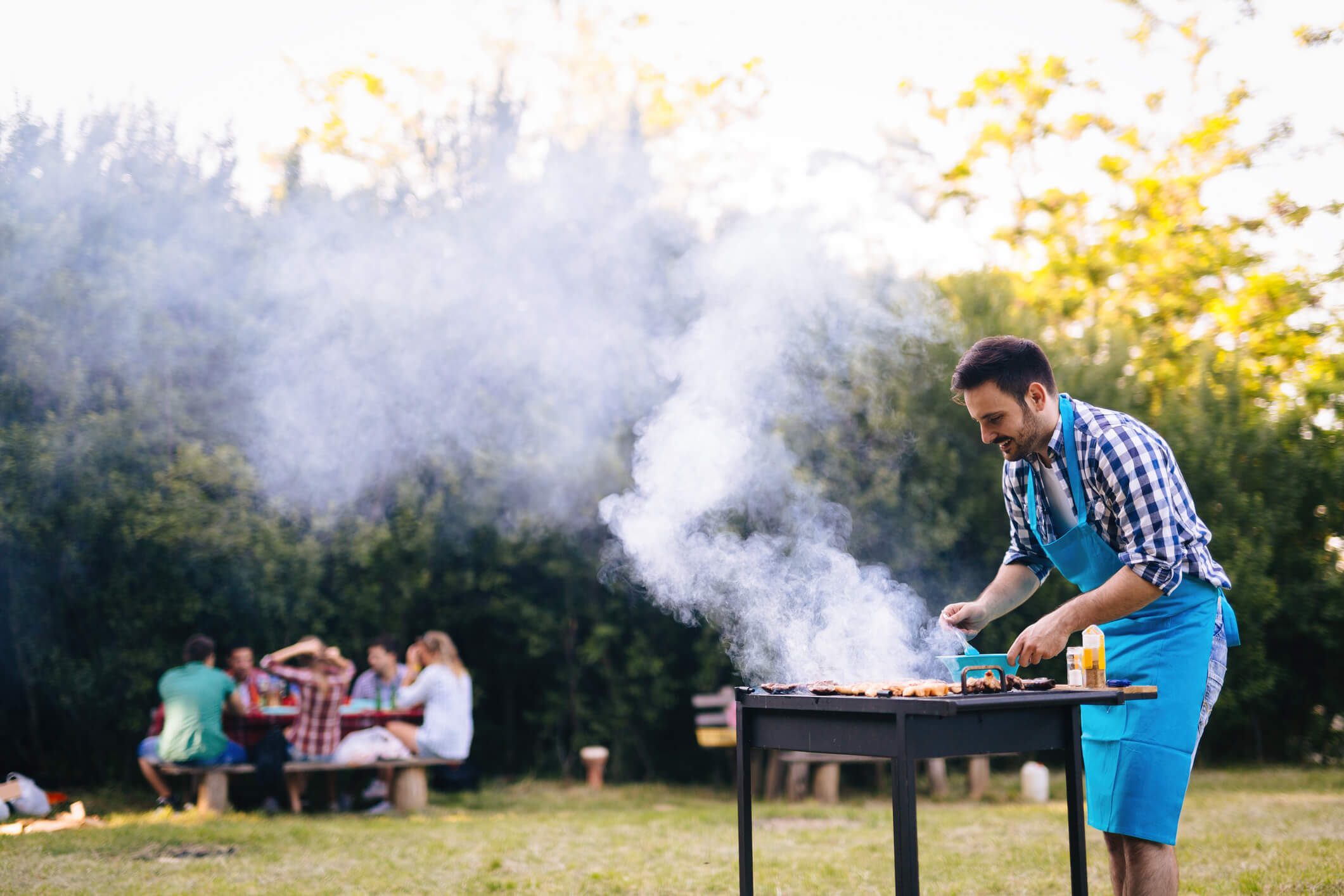 Man cooking food on a barbecue 