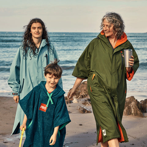 three people wearing and celebrating the launch of the RED Recovered Robe range