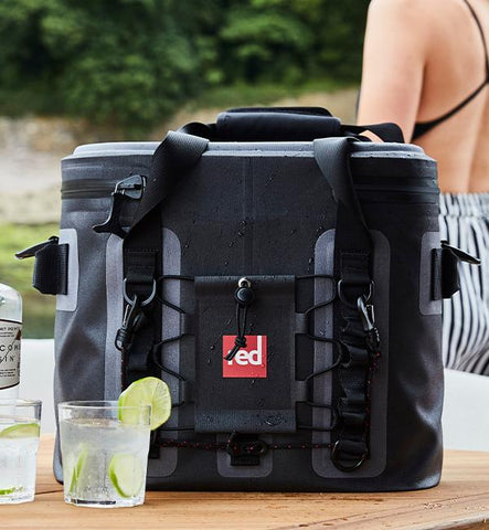 Lifestyle Shot Of Red Original Waterproof Cooler Bag filled with ice and bottles