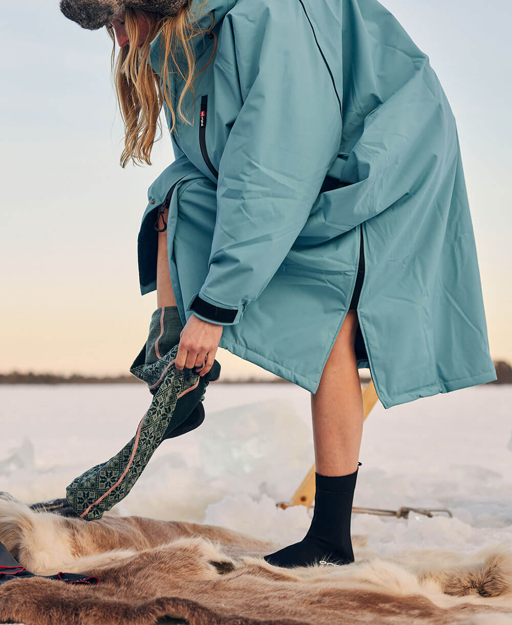 Women changing using a Pro Change EVO robe after ice swimming 